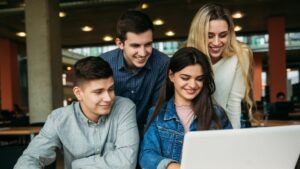 Group of college students using AI in a study group session